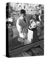 Shopkeeper Unpacking Canned Gammon Joints, Mexborough, South Yorkshire, 1963-Michael Walters-Stretched Canvas