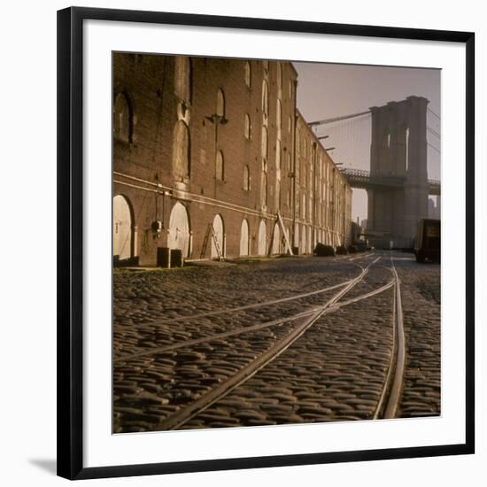 Shuttered Warehouses Lit by Sunlight on Trolley Track Railed Street Along Brooklyn Waterfront-Walker Evans-Framed Photographic Print