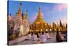 Shwedagon Paya (Pagoda) at Dusk with Buddhist Worshippers Praying-Lee Frost-Stretched Canvas