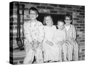 Siblings Perch on a Hearth in Pajamas, Ca. 1970-null-Stretched Canvas