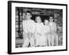 Siblings Perch on a Hearth in Pajamas, Ca. 1970-null-Framed Photographic Print