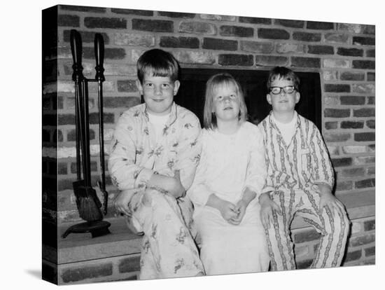 Siblings Pose on the Hearth in Pajamas, Ca. 1970-null-Stretched Canvas