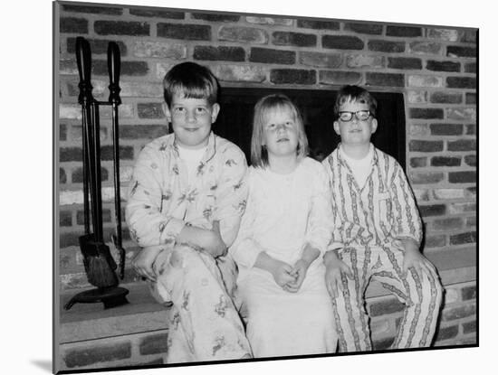 Siblings Pose on the Hearth in Pajamas, Ca. 1970-null-Mounted Premium Photographic Print