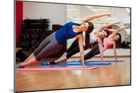 Side Plank Yoga Pose By Three Women-Antonio Diaz-Mounted Poster