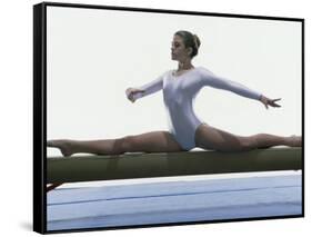 Side Profile of a Female Gymnast Stretching on a Balance Beam-null-Framed Stretched Canvas