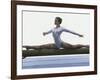 Side Profile of a Female Gymnast Stretching on a Balance Beam-null-Framed Photographic Print