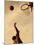 Side Profile of a Mid Adult Man Playing Basketball-null-Mounted Photographic Print