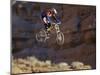 Side Profile of a Person on a Bicycle in Mid Air-null-Mounted Premium Photographic Print
