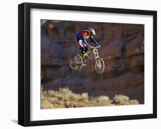 Side Profile of a Person on a Bicycle in Mid Air-null-Framed Photographic Print