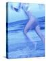 Side Profile of a Woman Running on the Beach-null-Stretched Canvas