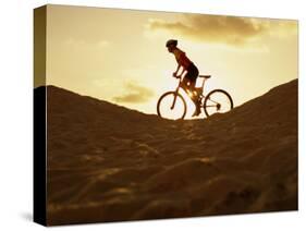 Side Profile of a Young Woman Cycling-null-Stretched Canvas