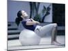 Side Profile of a Young Woman Exercising on a Fitness Ball-null-Mounted Photographic Print