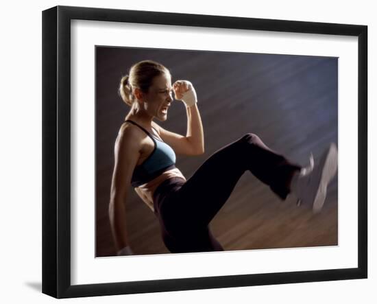 Side Profile of a Young Woman Kickboxing-null-Framed Photographic Print