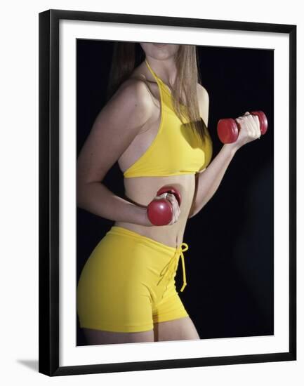 Side Profile of a Young Woman Lifting Dumbbells-null-Framed Premium Photographic Print