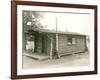 Side View of a Log Cabin Home-null-Framed Photo