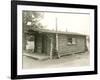 Side View of a Log Cabin Home-null-Framed Photo