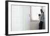 Side View of Mother and Daughter Looking Out of Window Blinds-Nosnibor137-Framed Photographic Print