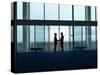 Side View of Two Silhouette Businessmen Shaking Hands in the Airport Lobby-Nosnibor137-Stretched Canvas