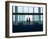 Side View of Two Silhouette Businessmen Shaking Hands in the Airport Lobby-Nosnibor137-Framed Photographic Print