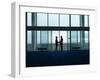 Side View of Two Silhouette Businessmen Shaking Hands in the Airport Lobby-Nosnibor137-Framed Photographic Print