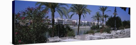 Sidewalk Cafe at the Riverside, Guadalquivir River, Seville, Spain-null-Stretched Canvas