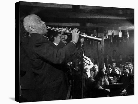 Sidney Bechet Performing in Small Basement Club "Vieux Colombier"-Nat Farbman-Stretched Canvas