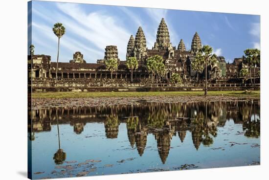 Siem Reap, Cambodia. Ancient ruins and towers of the Bayon Temple Angkor Wat-Miva Stock-Stretched Canvas