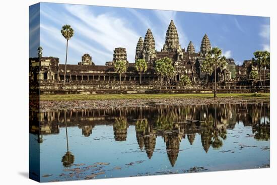 Siem Reap, Cambodia. Ancient ruins and towers of the Bayon Temple Angkor Wat-Miva Stock-Stretched Canvas