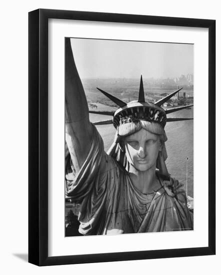 Sightseers Hanging Out Windows in Crown of Statue of Liberty with NJ Shore in the Background-Margaret Bourke-White-Framed Premium Photographic Print