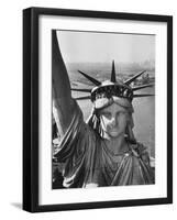 Sightseers Hanging Out Windows in Crown of Statue of Liberty with NJ Shore in the Background-Margaret Bourke-White-Framed Photographic Print