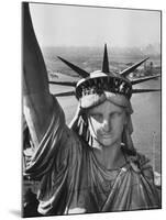 Sightseers Hanging Out Windows in Crown of Statue of Liberty with NJ Shore in the Background-Margaret Bourke-White-Mounted Photographic Print