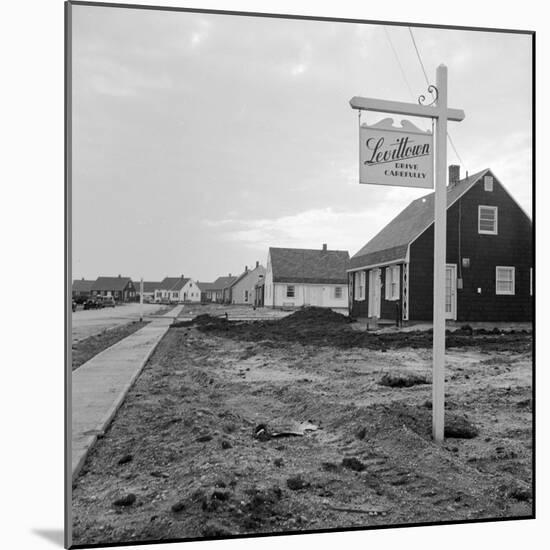 Sign Declaring the Area as Levittown Outside Newly Constructed Homes-null-Mounted Photographic Print