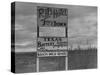 Sign on Road to Oil Boomtown-Carl Mydans-Stretched Canvas