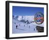 Sign with Skiers and Mountains in the Background at the Ski Resort of Livigno in Northern Italy-Teegan Tom-Framed Photographic Print