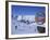 Sign with Skiers and Mountains in the Background at the Ski Resort of Livigno in Northern Italy-Teegan Tom-Framed Photographic Print