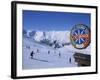 Sign with Skiers and Mountains in the Background at the Ski Resort of Livigno in Northern Italy-Teegan Tom-Framed Photographic Print
