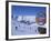 Sign with Skiers and Mountains in the Background at the Ski Resort of Livigno in Northern Italy-Teegan Tom-Framed Photographic Print