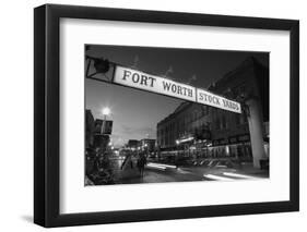 Signboard over a road at dusk, Fort Worth Stockyards, Fort Worth, Texas, USA-null-Framed Photographic Print