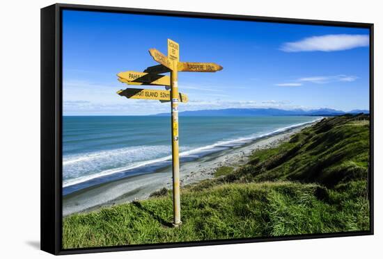 Signpost on Te Waewae Bay, Along the Road from Invercargill to Te Anau, South Island-Michael Runkel-Framed Stretched Canvas