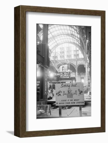 Signs Hanging over Renovation-null-Framed Photographic Print