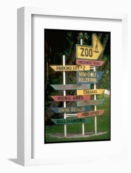 Signs Pointing Every Which Way, Key Biscayne, Florida-George Silk-Framed Photographic Print