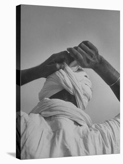 Sikh Man Demonstrating How He Finishes the Winding of His Traditional Turban around His Head-Margaret Bourke-White-Stretched Canvas