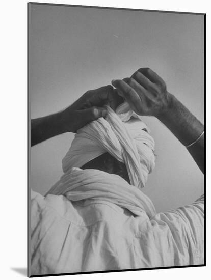 Sikh Man Demonstrating How He Finishes the Winding of His Traditional Turban around His Head-Margaret Bourke-White-Mounted Premium Photographic Print