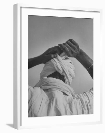 Sikh Man Demonstrating How He Finishes the Winding of His Traditional Turban around His Head-Margaret Bourke-White-Framed Photographic Print