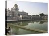 Sikh Pilgrim Bathing in the Pool of the Gurudwara Bangla Sahib Temple, Delhi, India-Eitan Simanor-Stretched Canvas