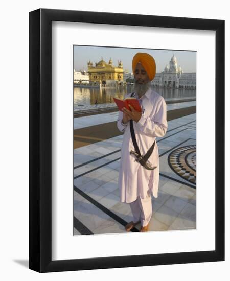 Sikh Pilgrim with Orange Turban, White Dress and Dagger, Reading Prayer Book, Amritsar-Eitan Simanor-Framed Premium Photographic Print