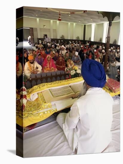 Sikh Priest and Holy Book at Sikh Wedding, London, England, United Kingdom-Charles Bowman-Stretched Canvas