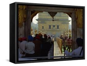 Sikhs at the Entrance to the Golden Temple, Crossing Guru's Bridge, Amritsar, Punjab, India-Jeremy Bright-Framed Stretched Canvas