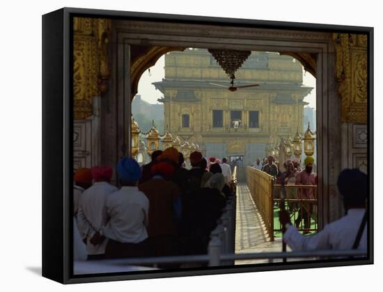 Sikhs at the Entrance to the Golden Temple, Crossing Guru's Bridge, Amritsar, Punjab, India-Jeremy Bright-Framed Stretched Canvas