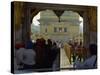 Sikhs at the Entrance to the Golden Temple, Crossing Guru's Bridge, Amritsar, Punjab, India-Jeremy Bright-Stretched Canvas